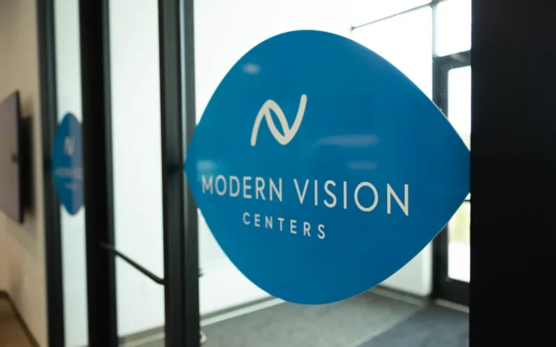 Modern Vision Centers logo on the clinic door in West Des Moines
